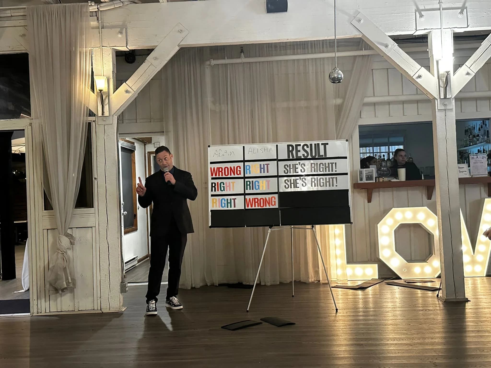 Mike Oulton hosting an audience segment with a live scoreboard